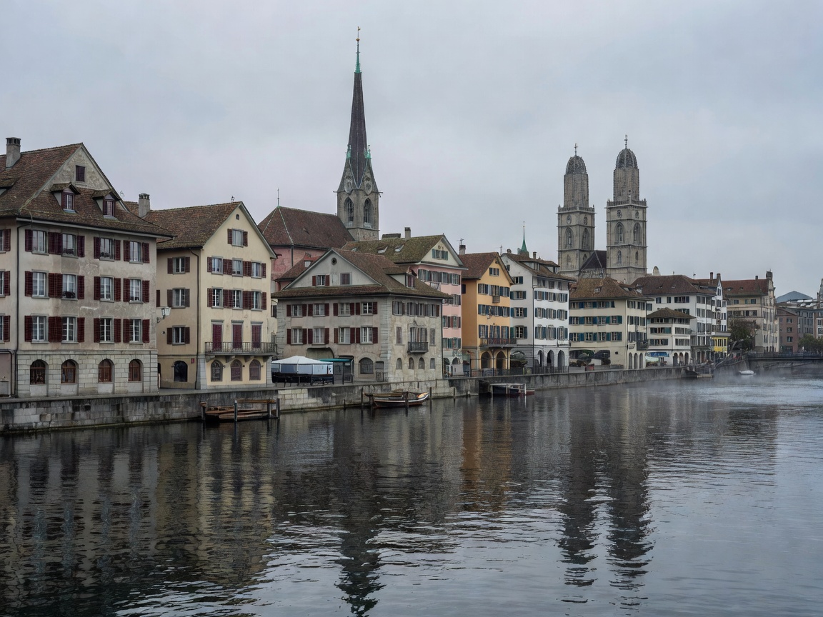 Panoramic view of historic Zurich architecture across the Limmat river